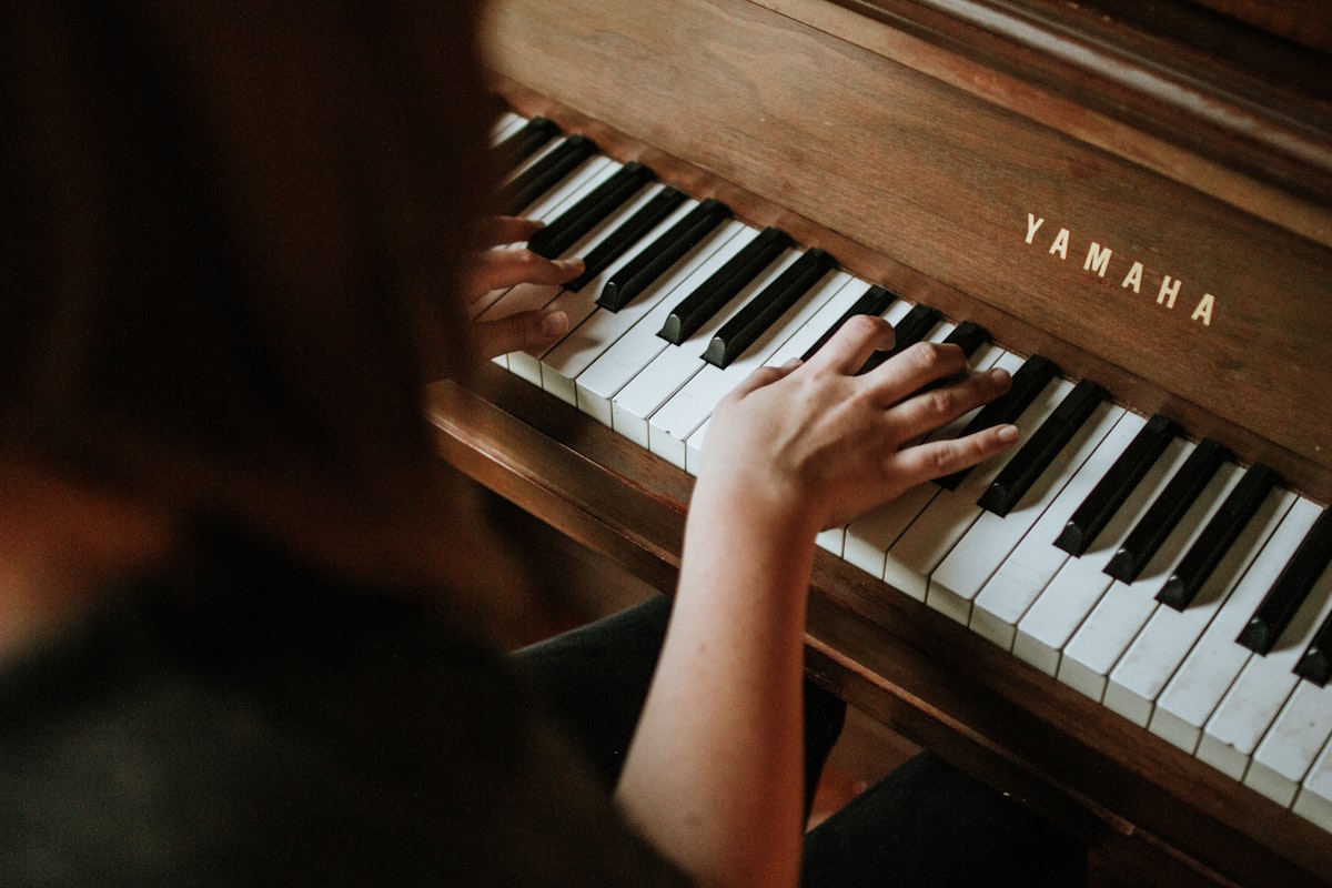 Student practising at the studio upright piano